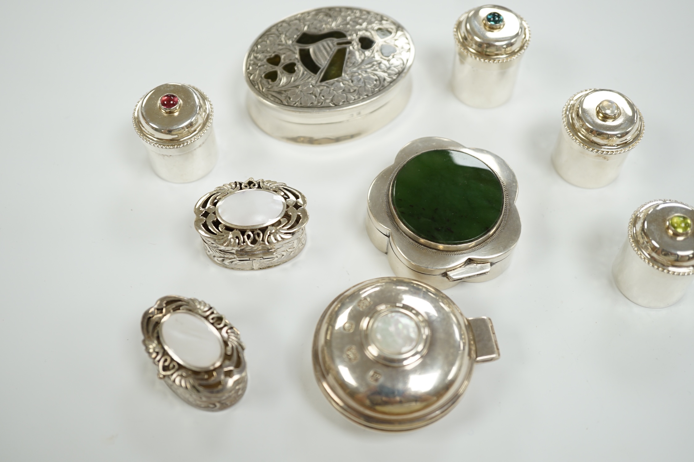 Nine assorted mainly modern silver or white metal and hardstone/cabochon set pill boxes, largest 59mm.